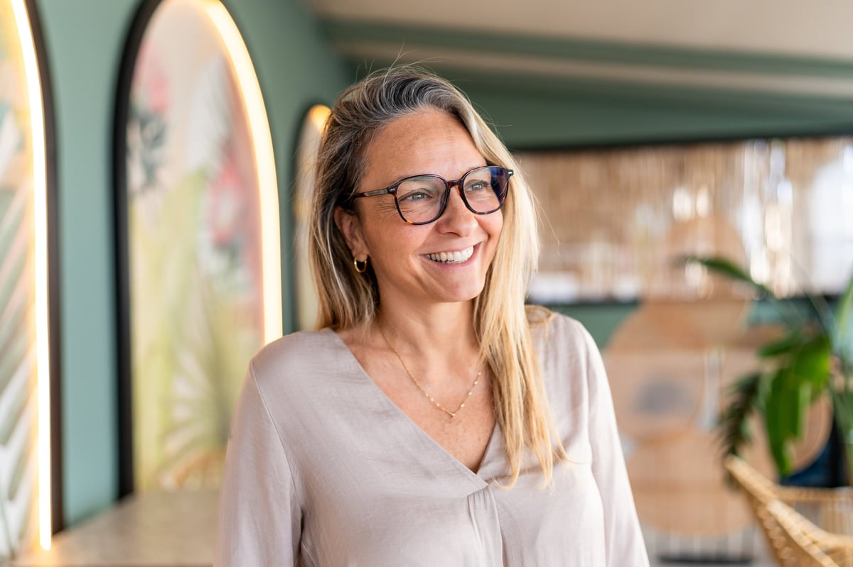 Smiling mature woman customer wearing glasses