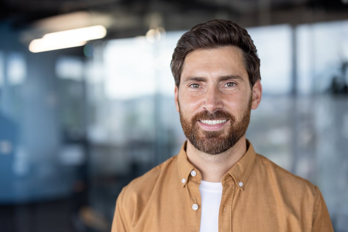 Confident man customer smiling wearing casual shirt