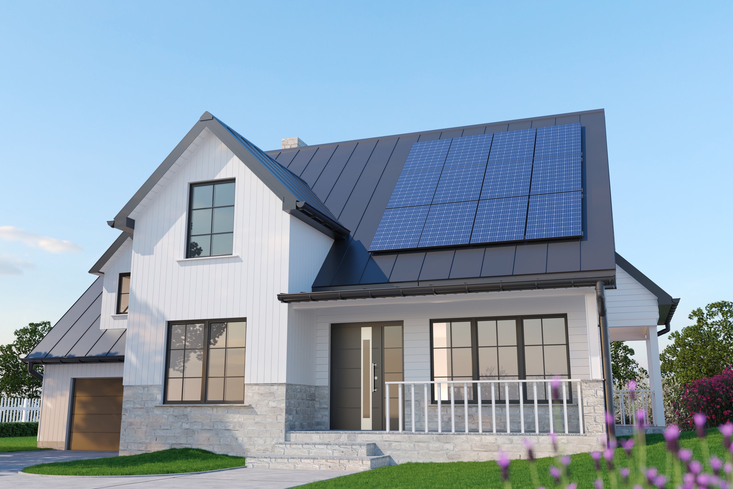 Modern single-family American house with rooftop solar panels installed on a dark metal roof