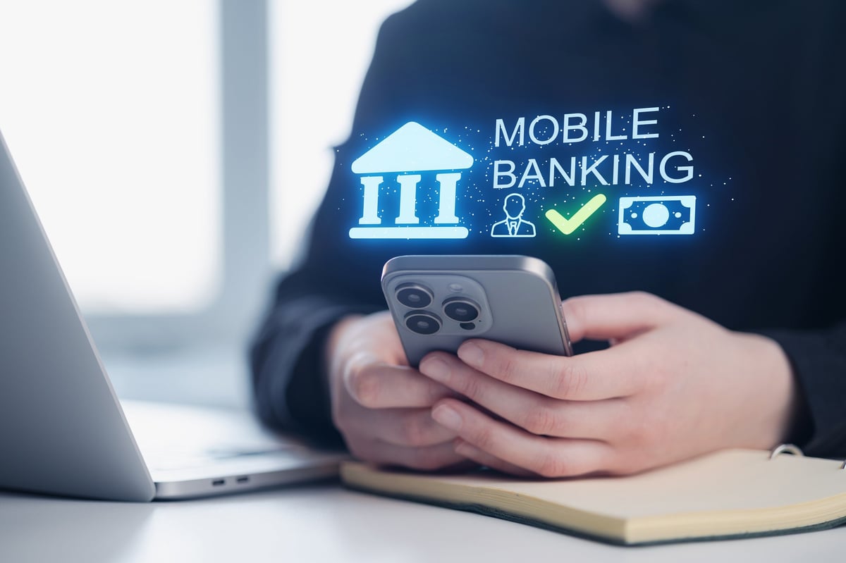 Person using mobile banking app for solar financing approval on smartphone