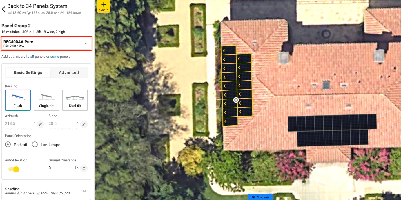 Aerial view of a rooftop solar panel system design with black panels on red tile roof and surrounding landscape